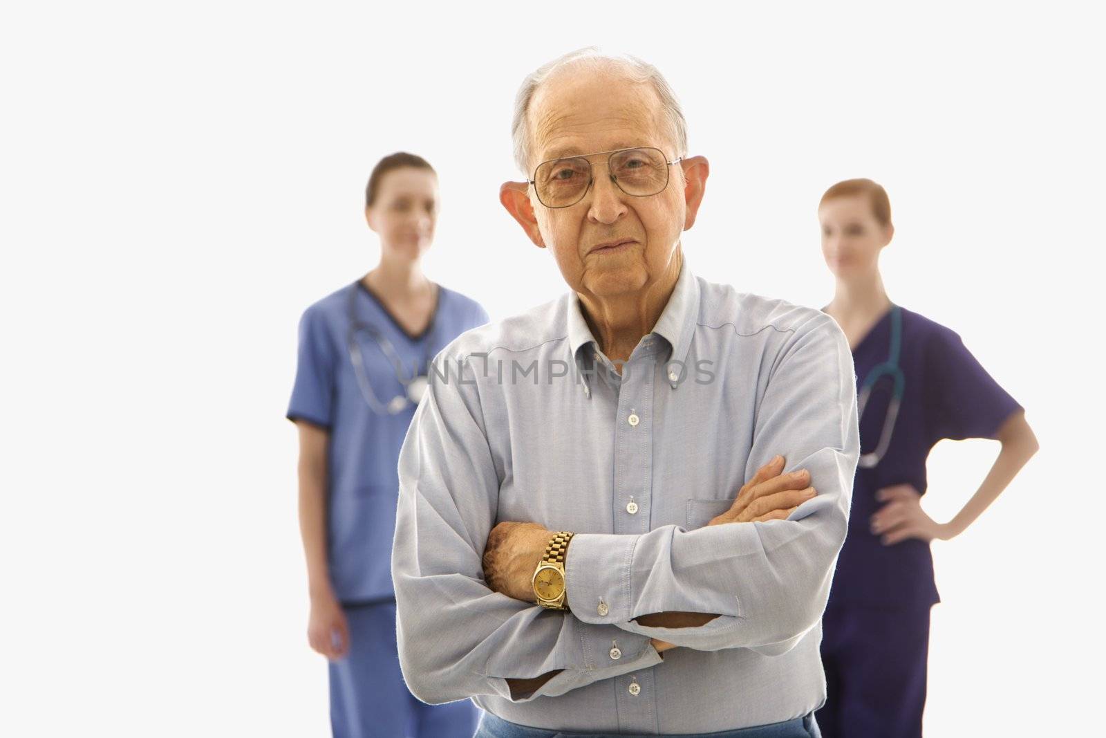 Man with healthcare workers. by iofoto