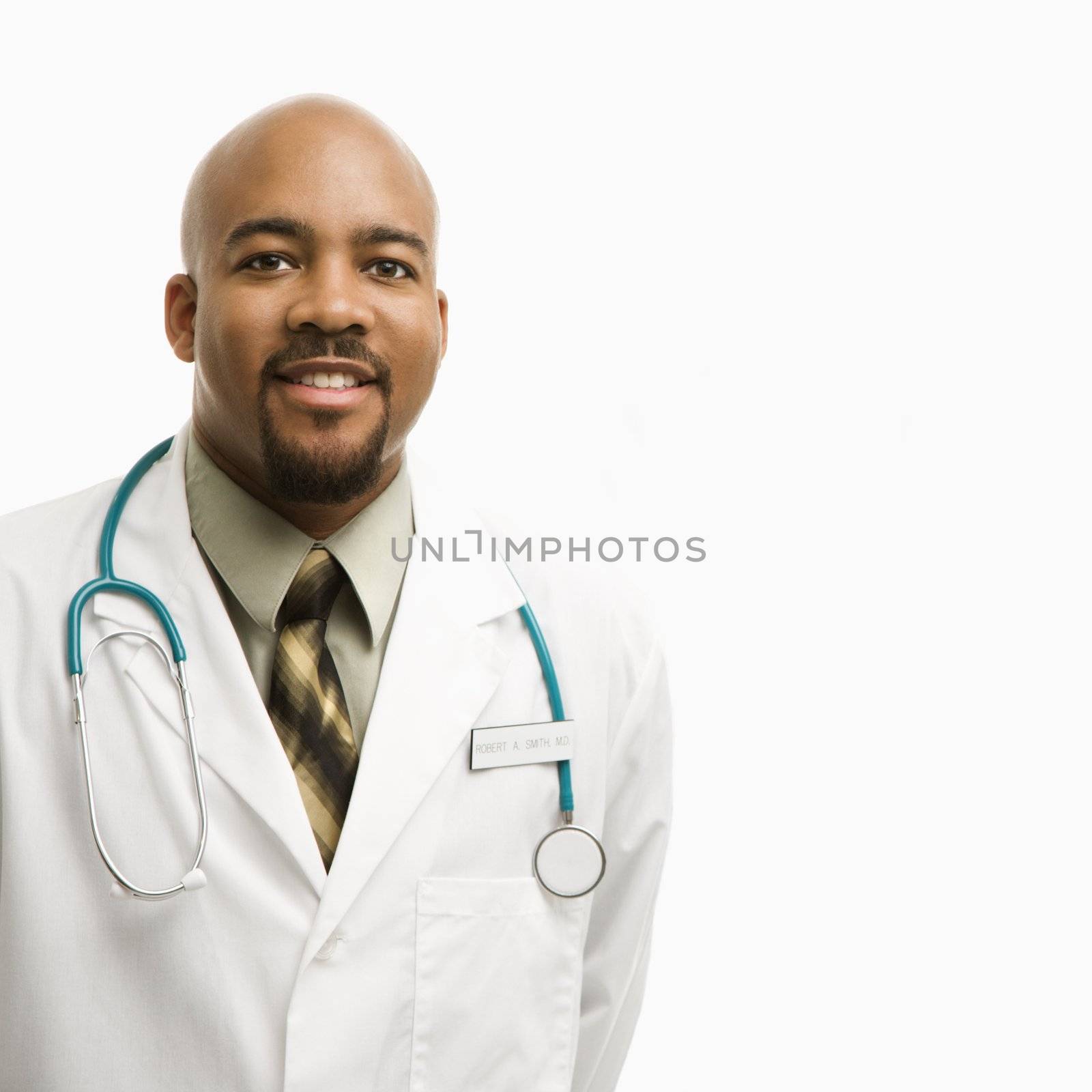 Male doctor smiling. by iofoto