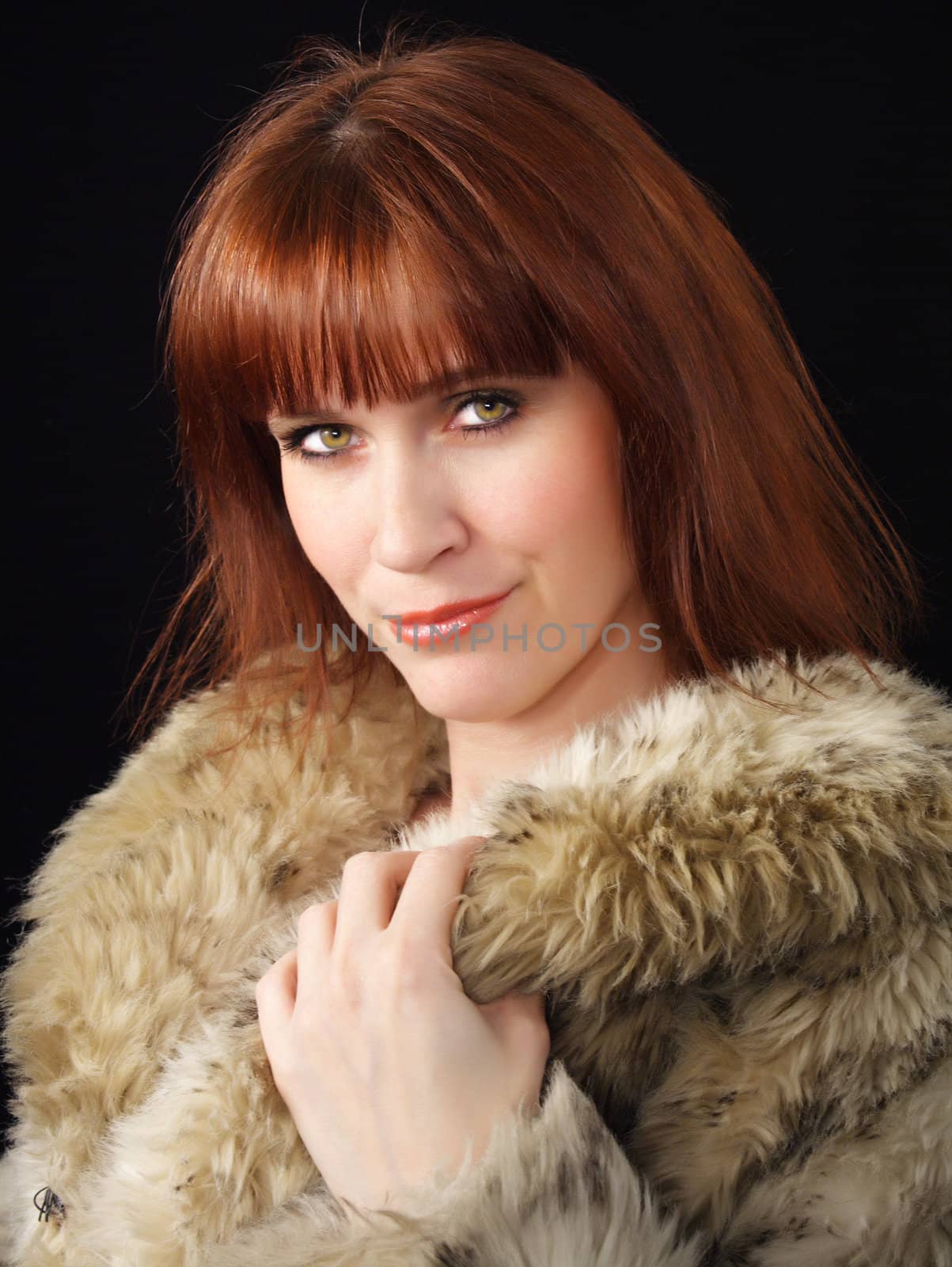ginger-haired woman with factitious fur coat