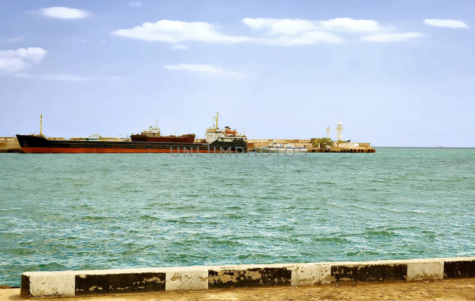 Large transport ship is far from the pier by selhin
