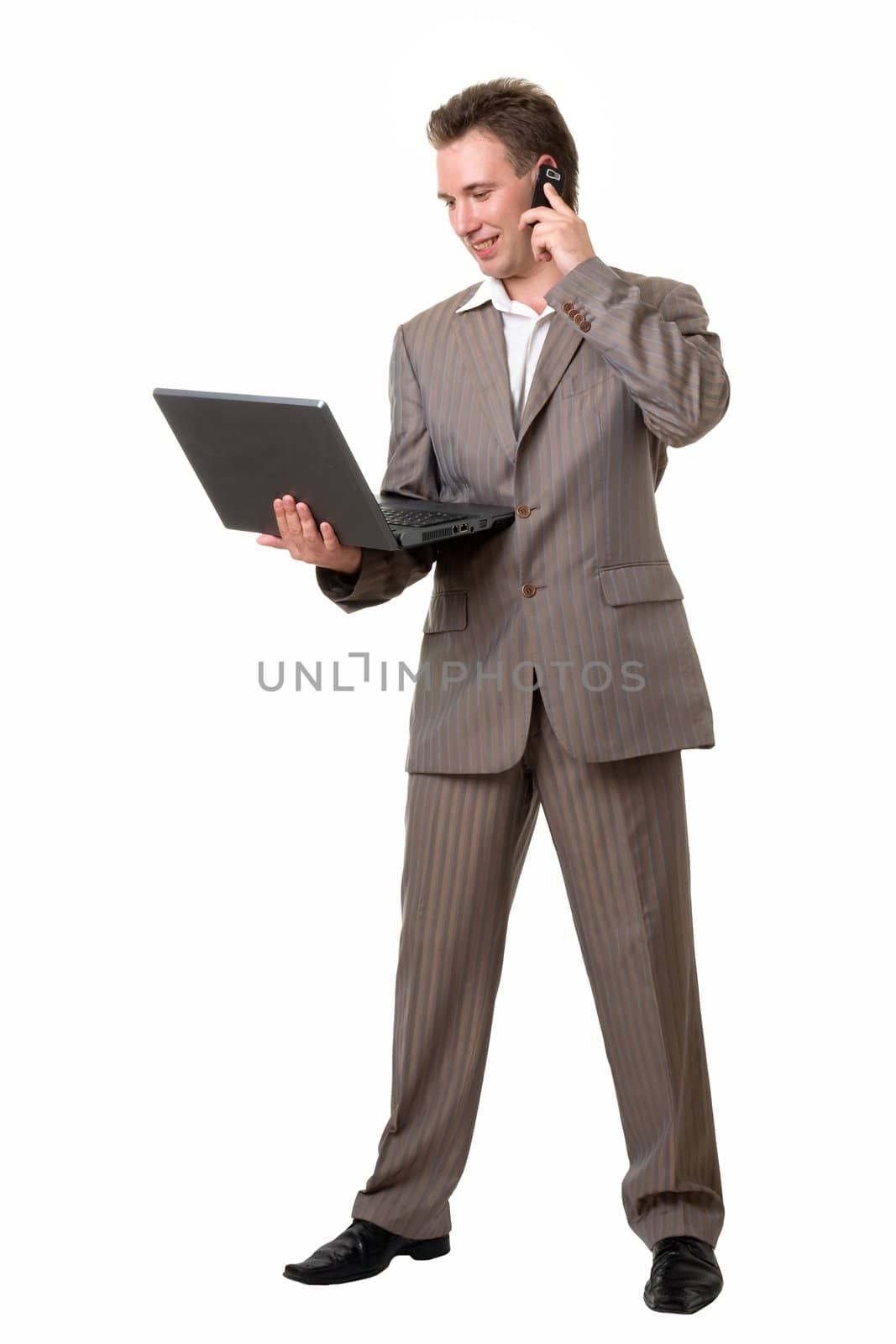 Young business man with notebook and mobile phone on a white background.