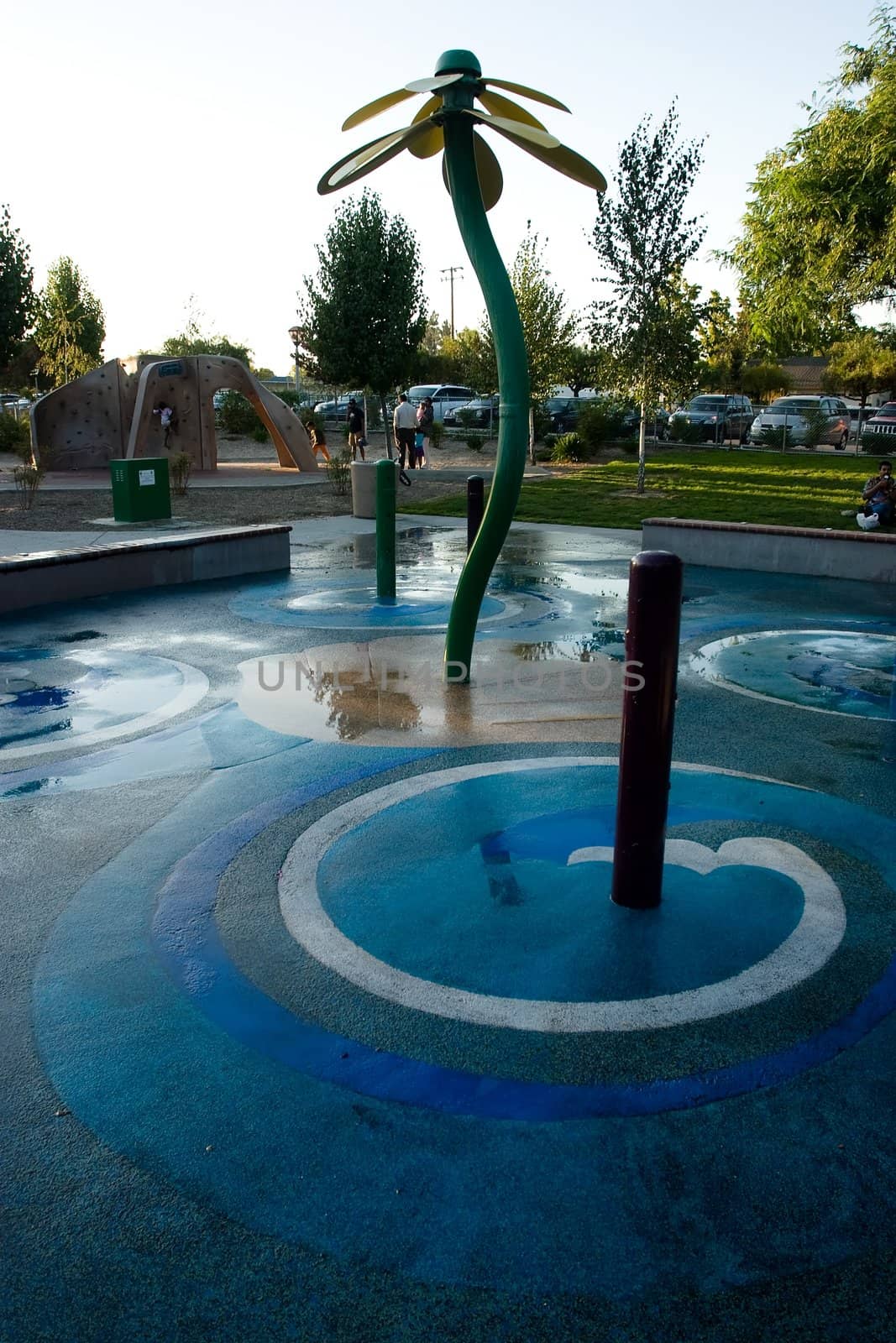 Fountain next to children's playground in a park