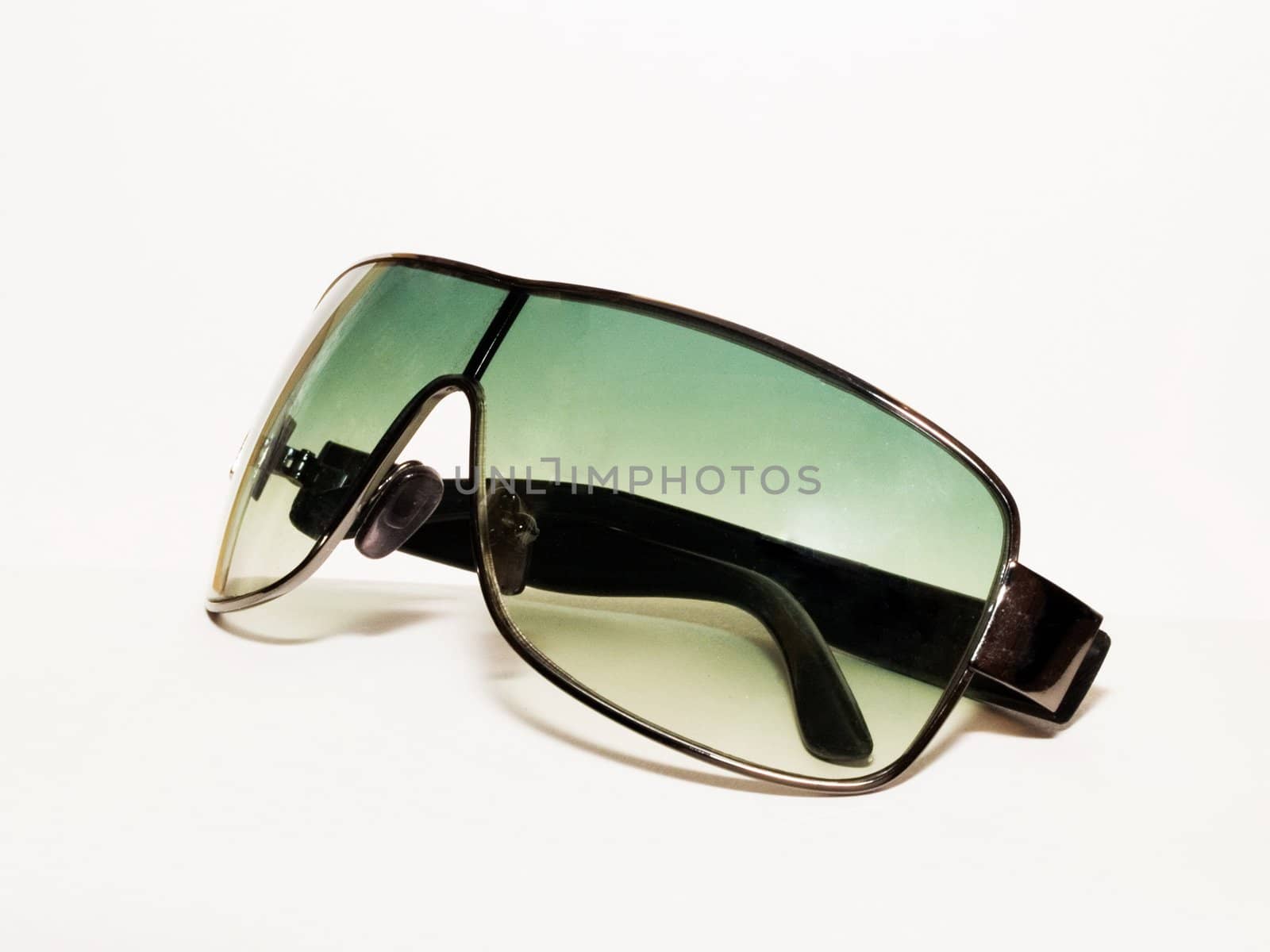 Green sunglasses isolated on white