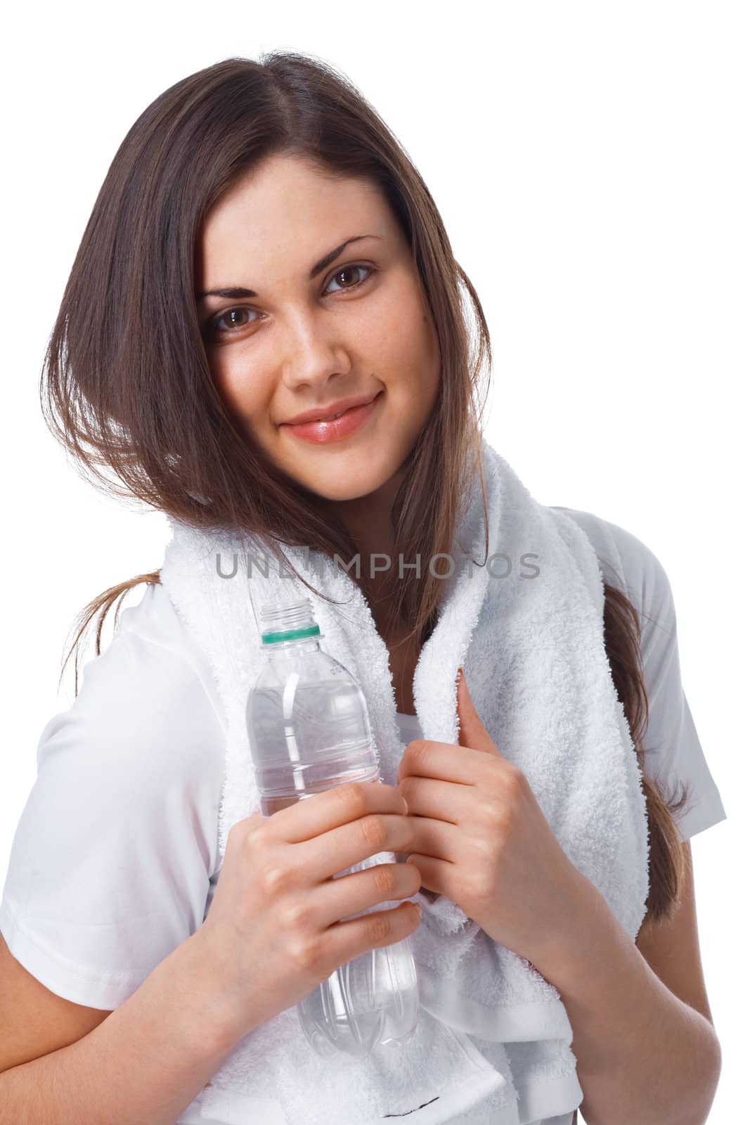 Portrait of a young woman with towel and bottle of water over white