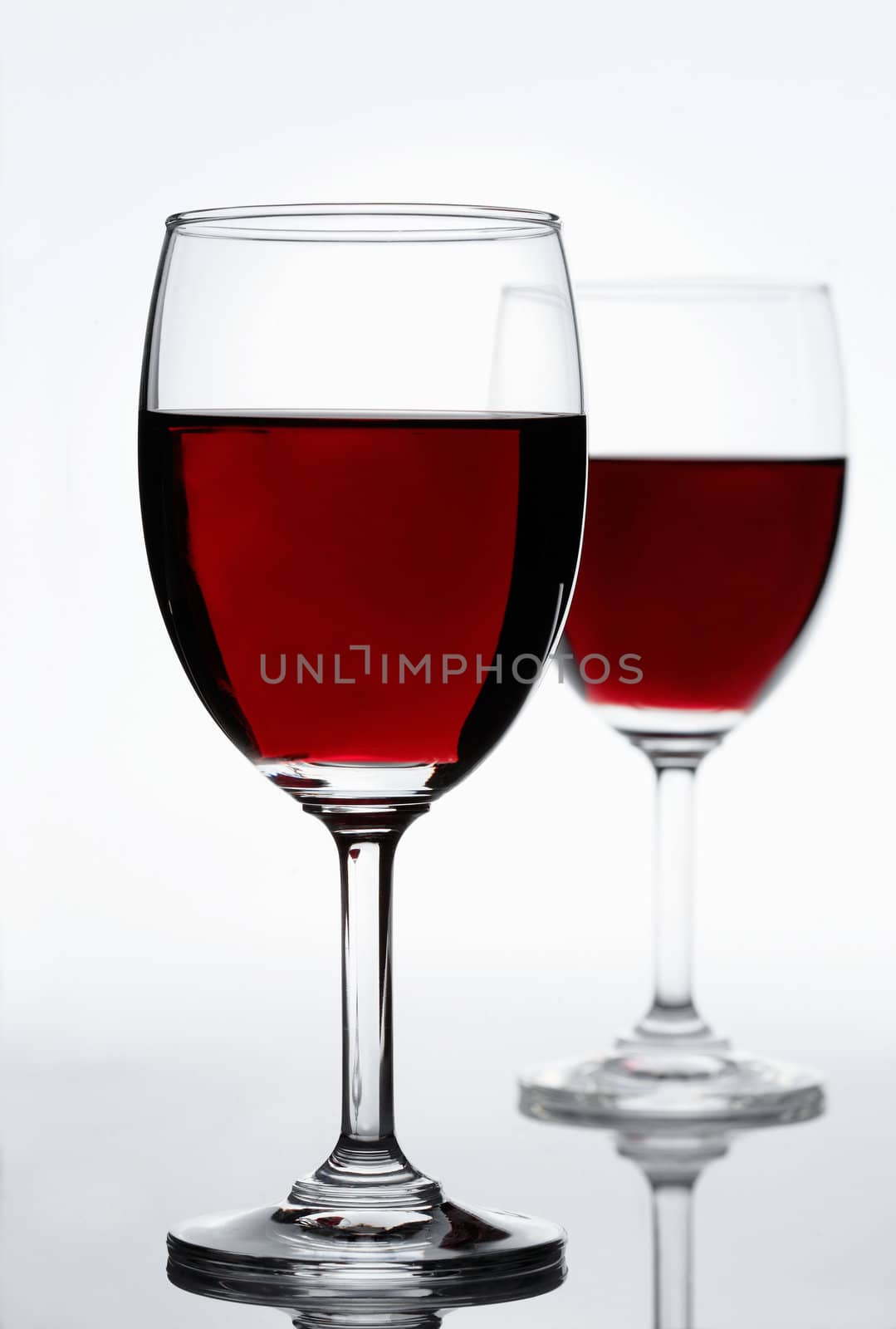 Two red wine glasses by romanshyshak