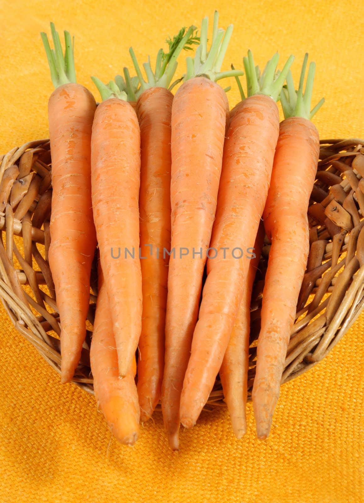fresh carrots in a wicker basket