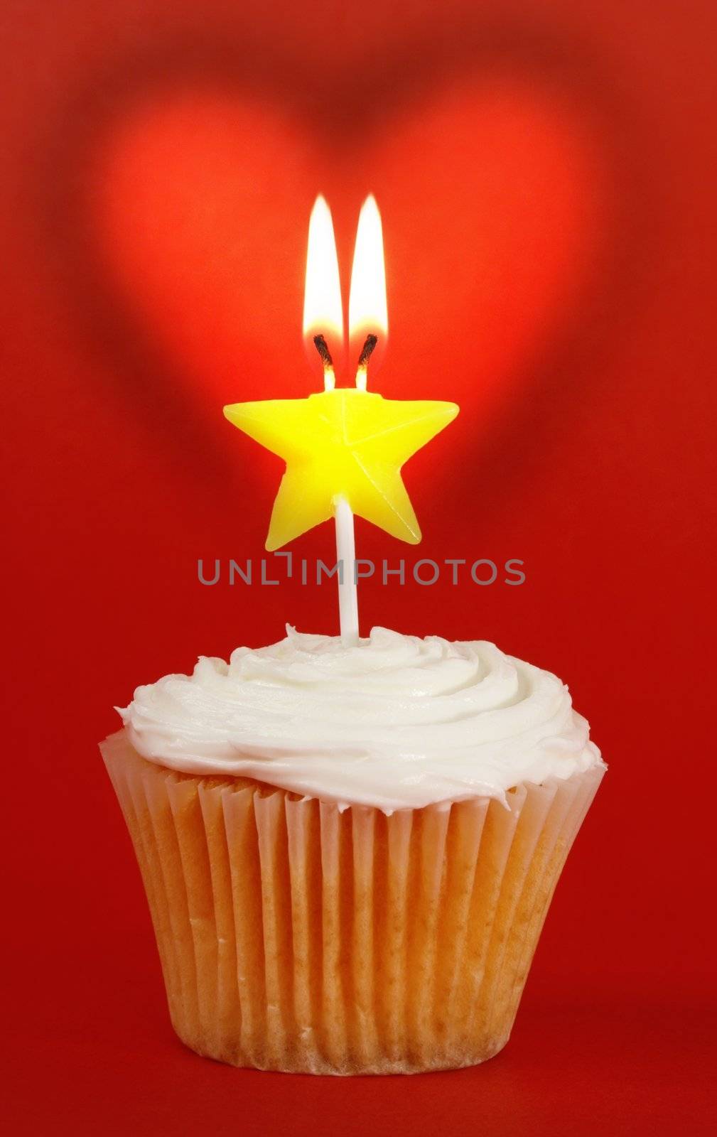 homemade cupcakes with star candle and heart