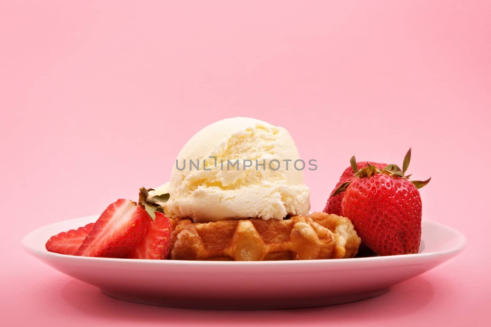 Belgian waffles with strawberries and ice cream