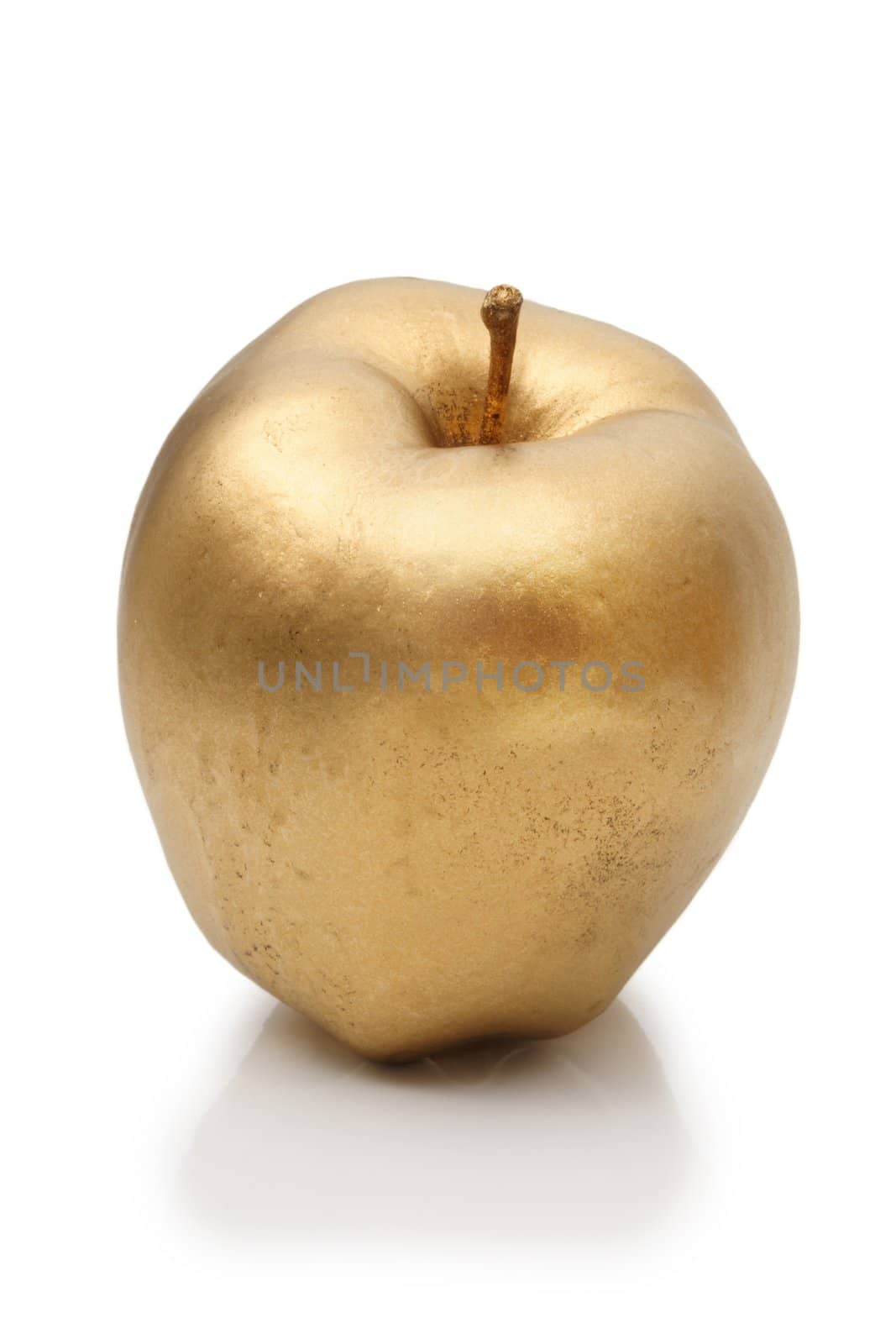 Metallic gold apple on white background