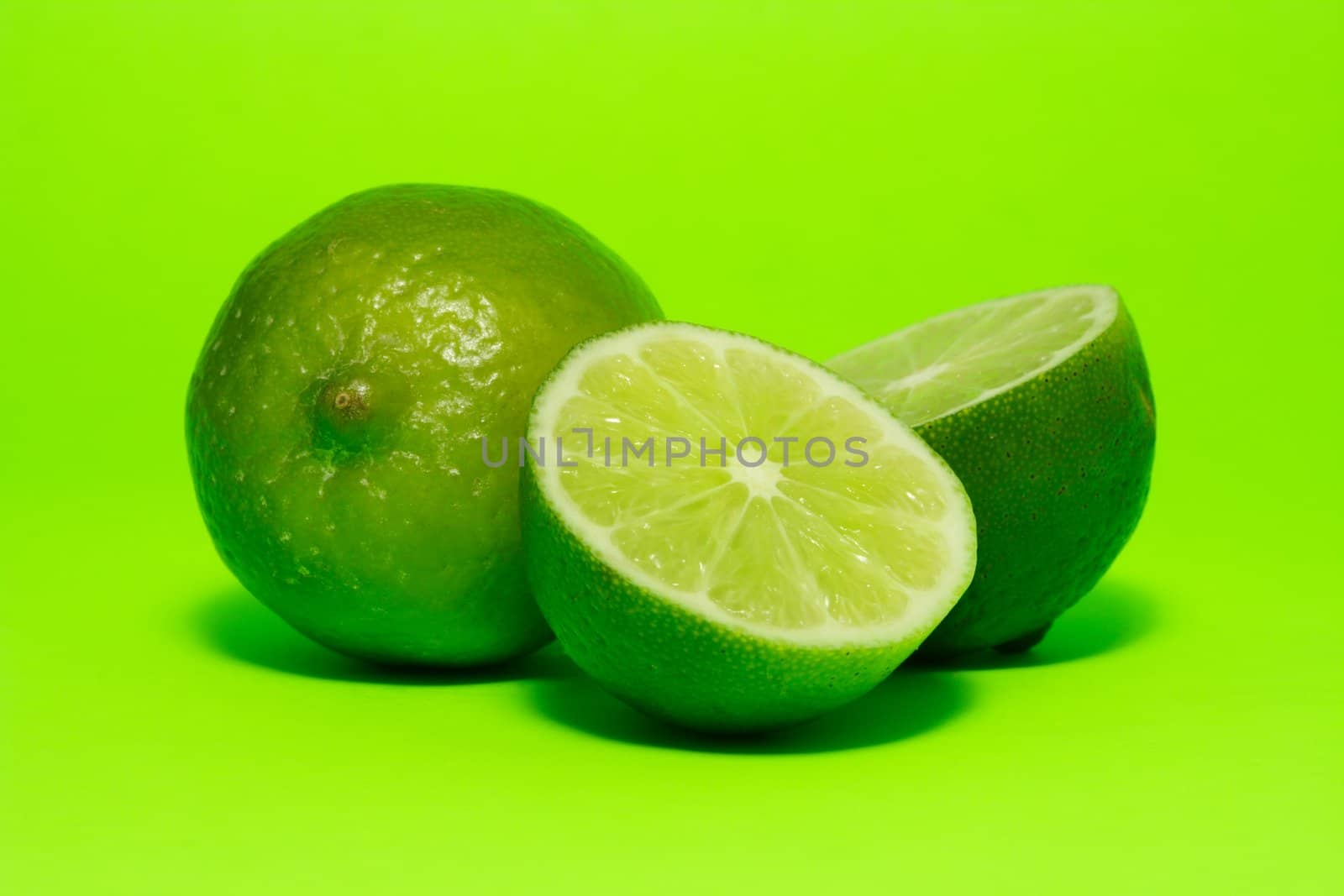 fresh lime on green background