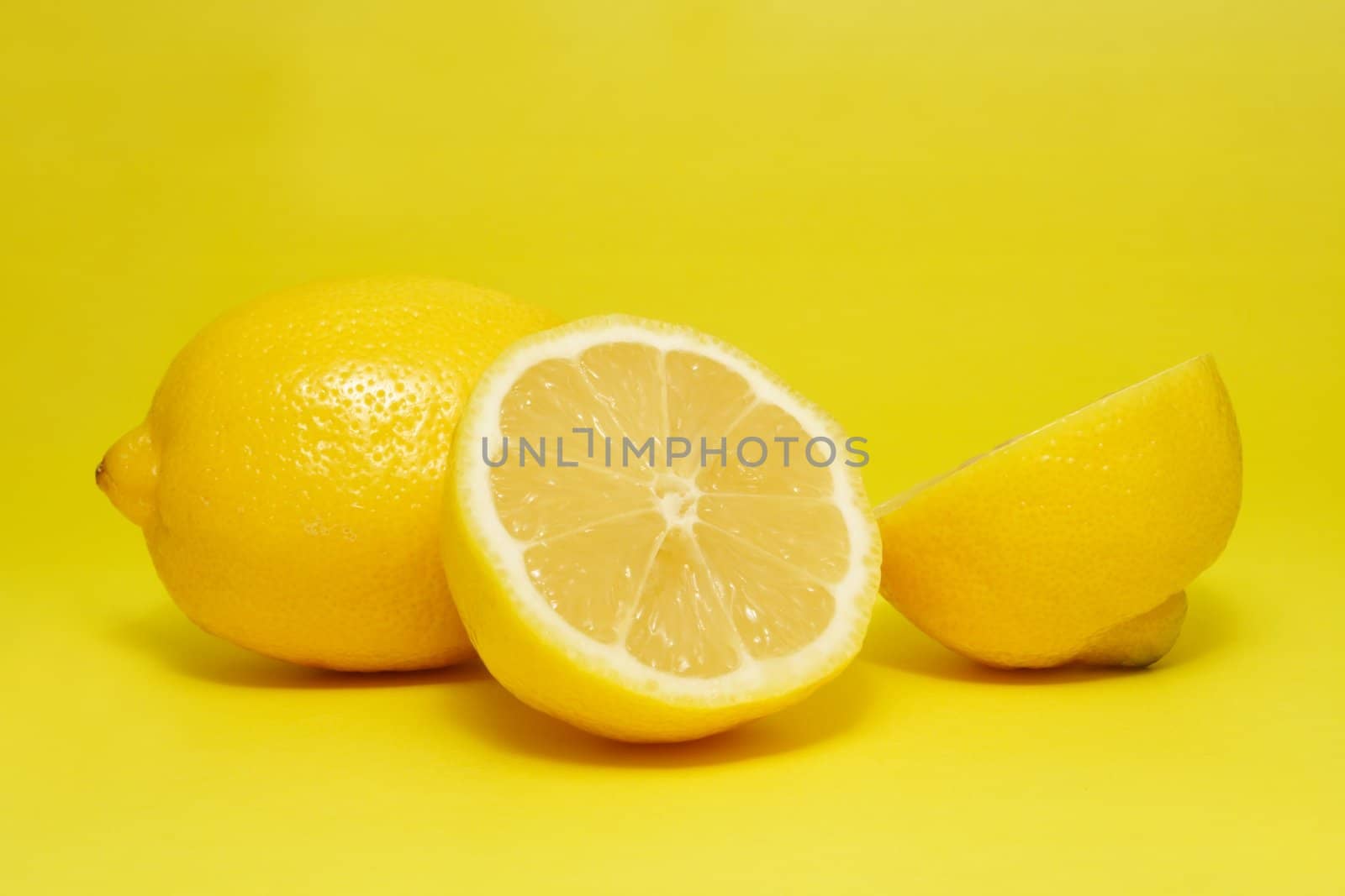 fresh lemon on yellow background