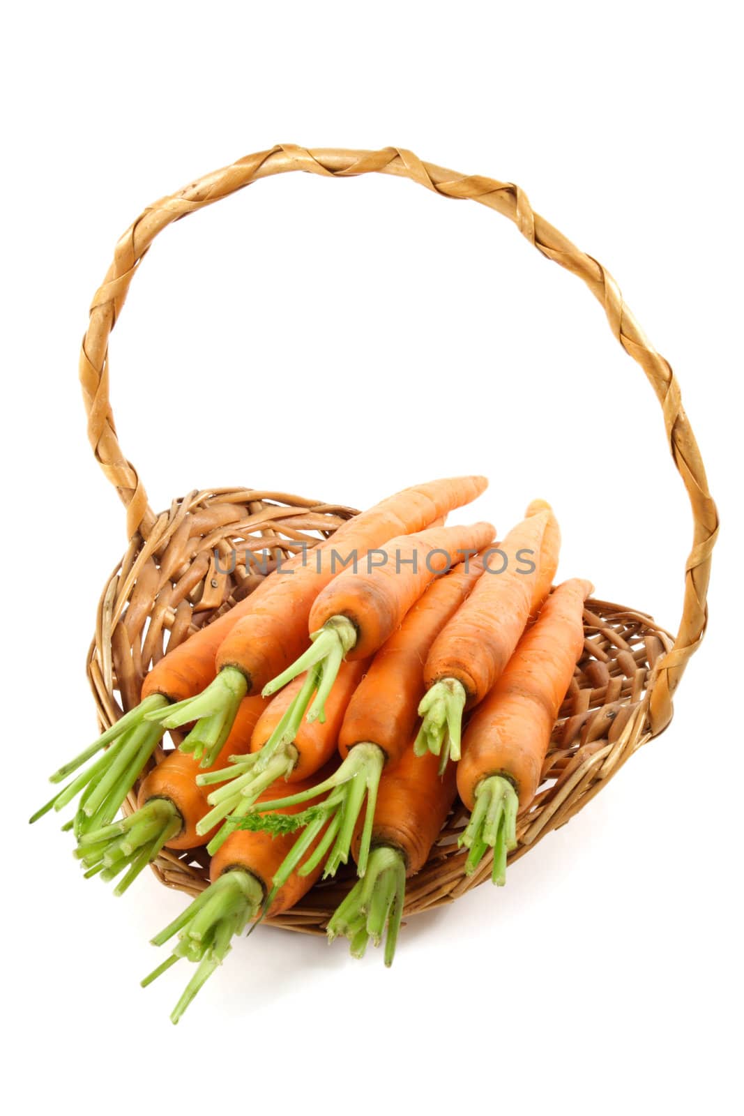 fresh carrots in a wicker basket