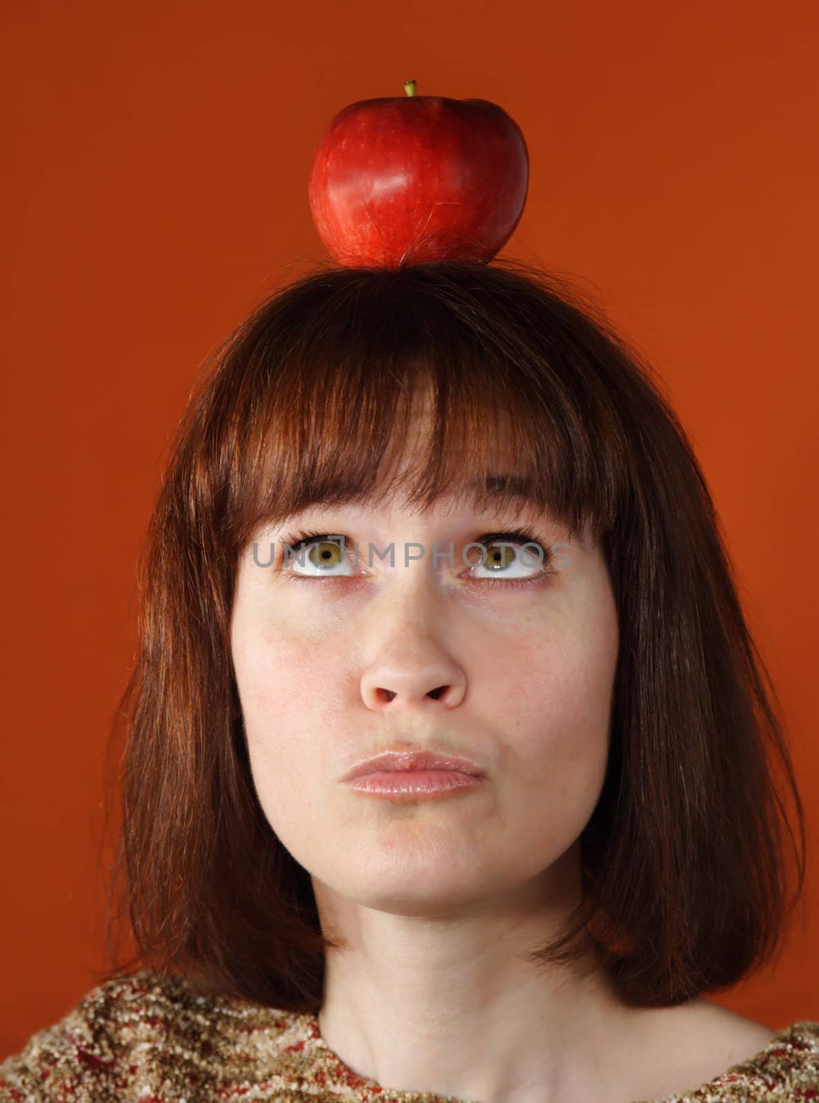 woman with an apple on top of her head
