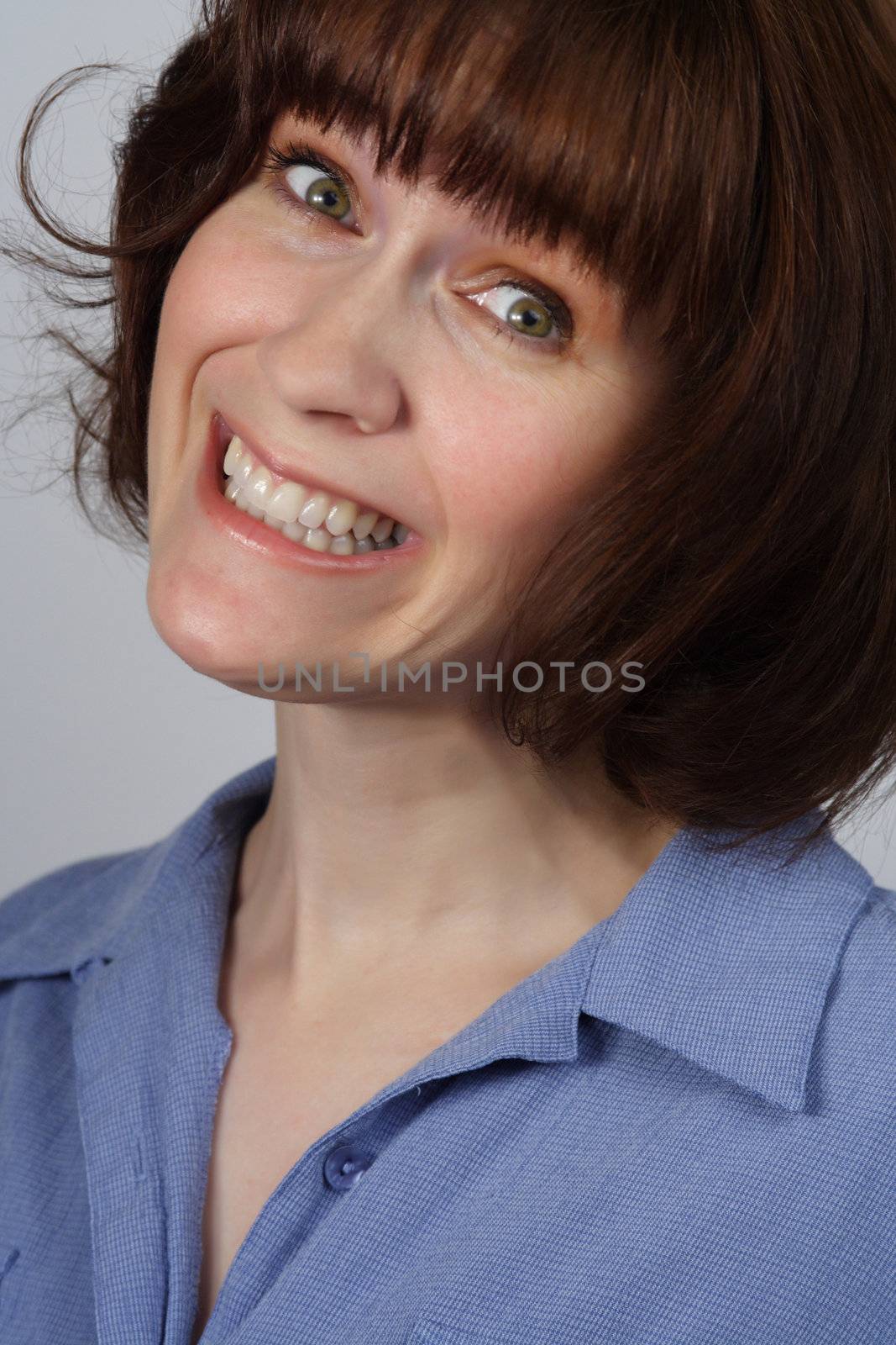 portrait of a woman with funny forced smile