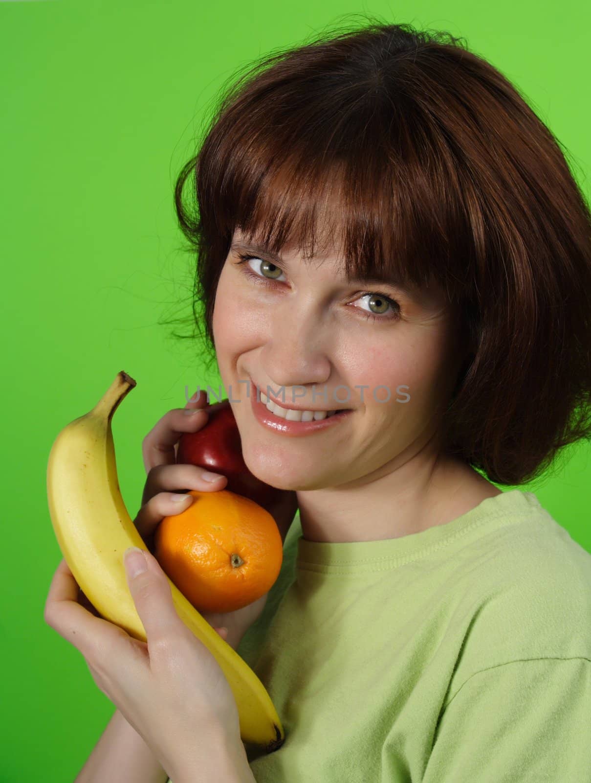 healthy woman holding some fresh fruit