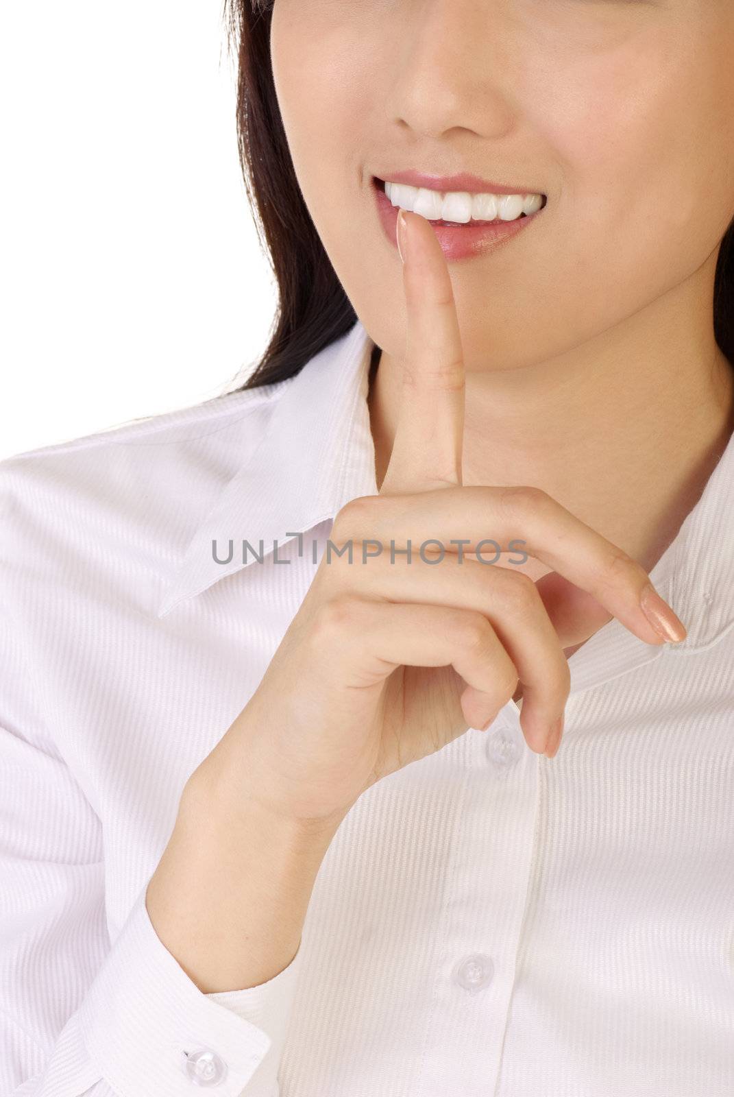 Silent sign with finger on lips of business woman on white background.
