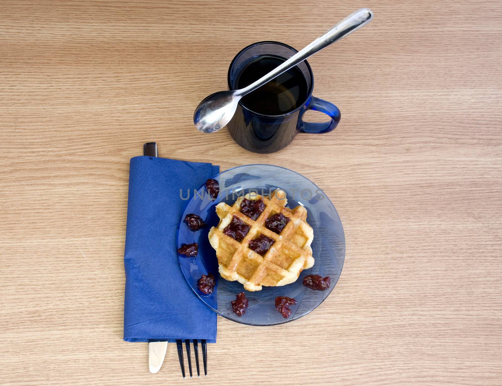 black tea and yummy jam waffle for breakfast