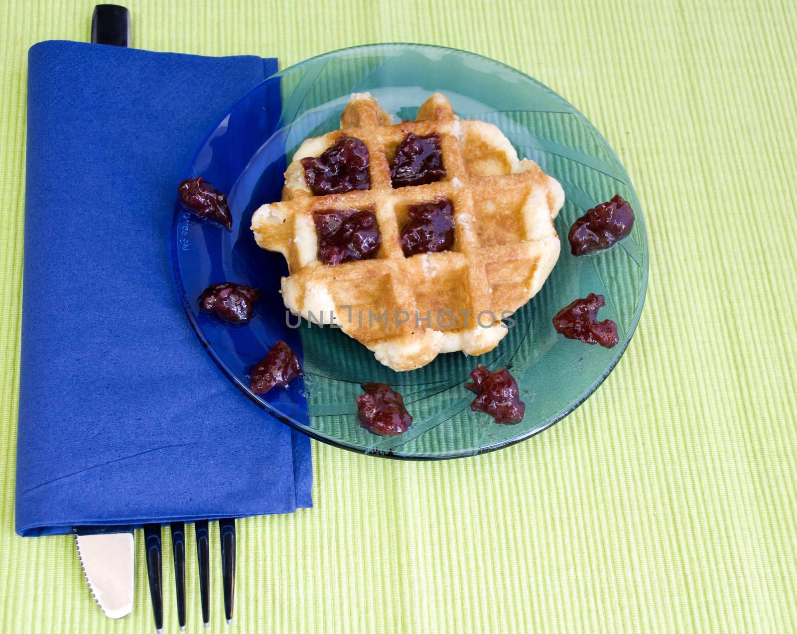 cherry jam on a hot waffle, freshly made