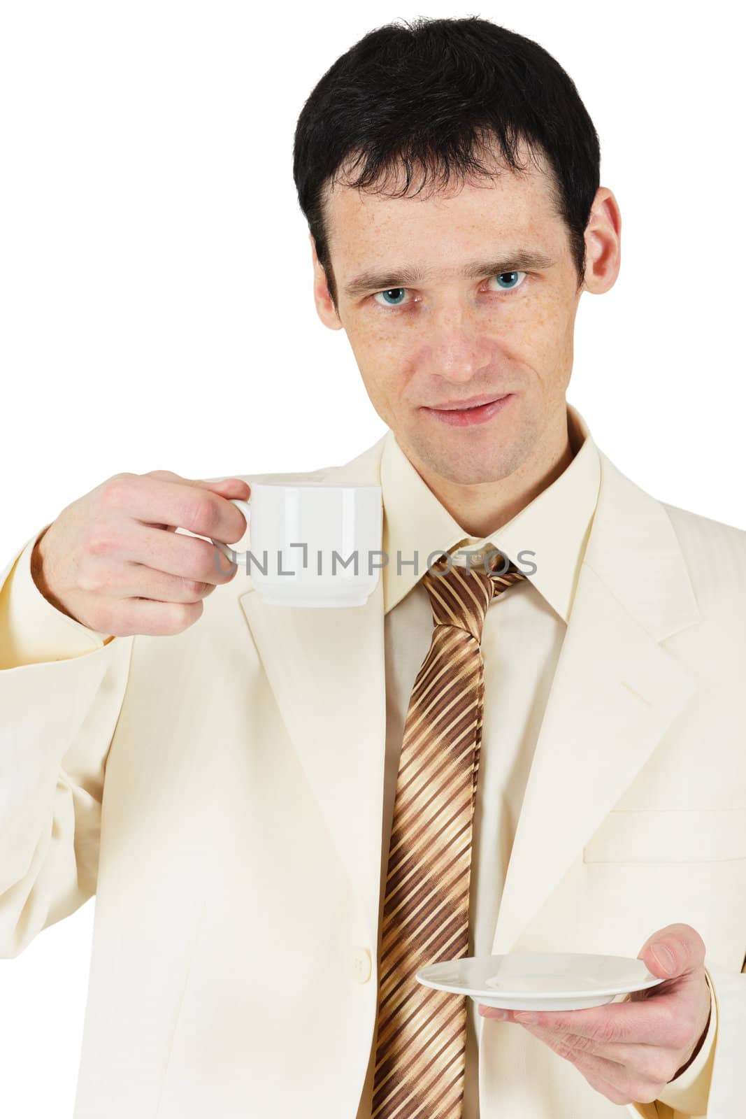 A man dressed in suit drinking tea on a white background