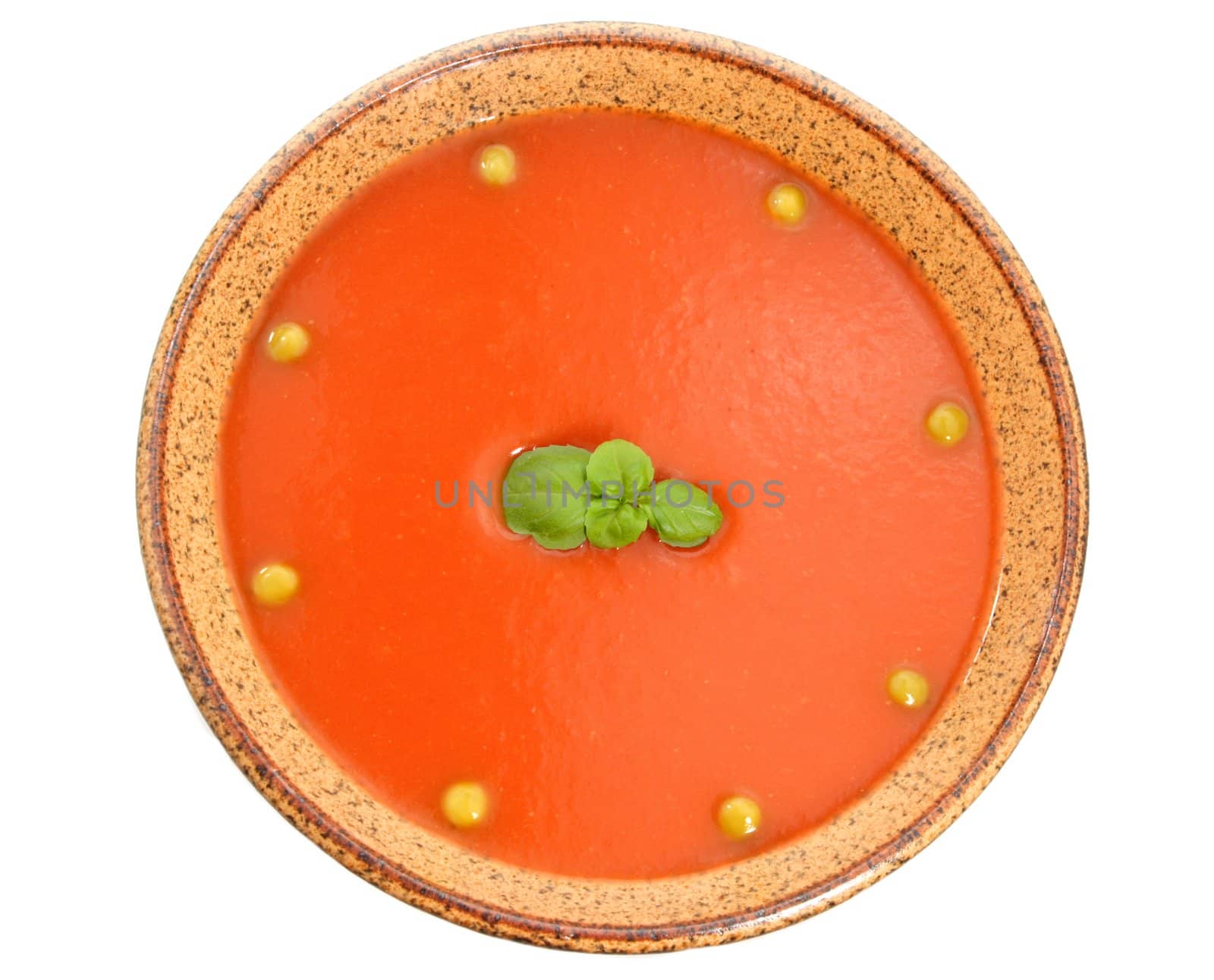 tomato soup in white bowl, red background