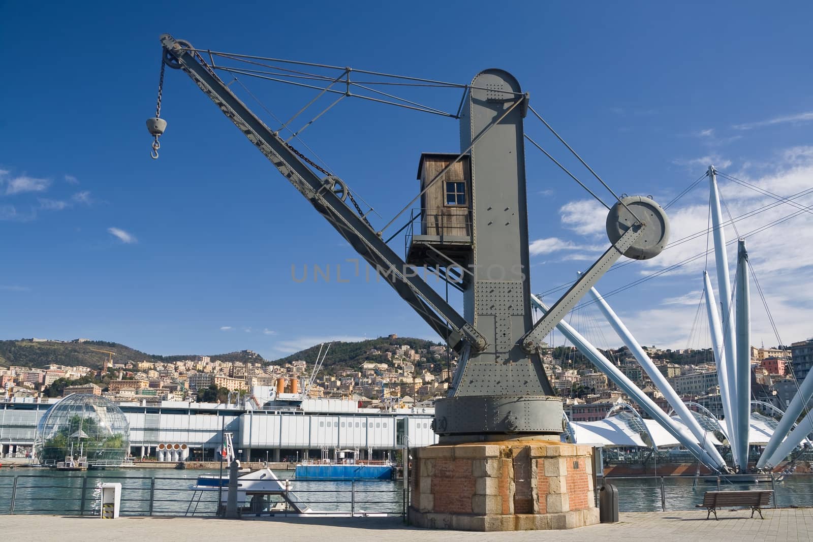  the port of Genoa with on ald crane on foreground