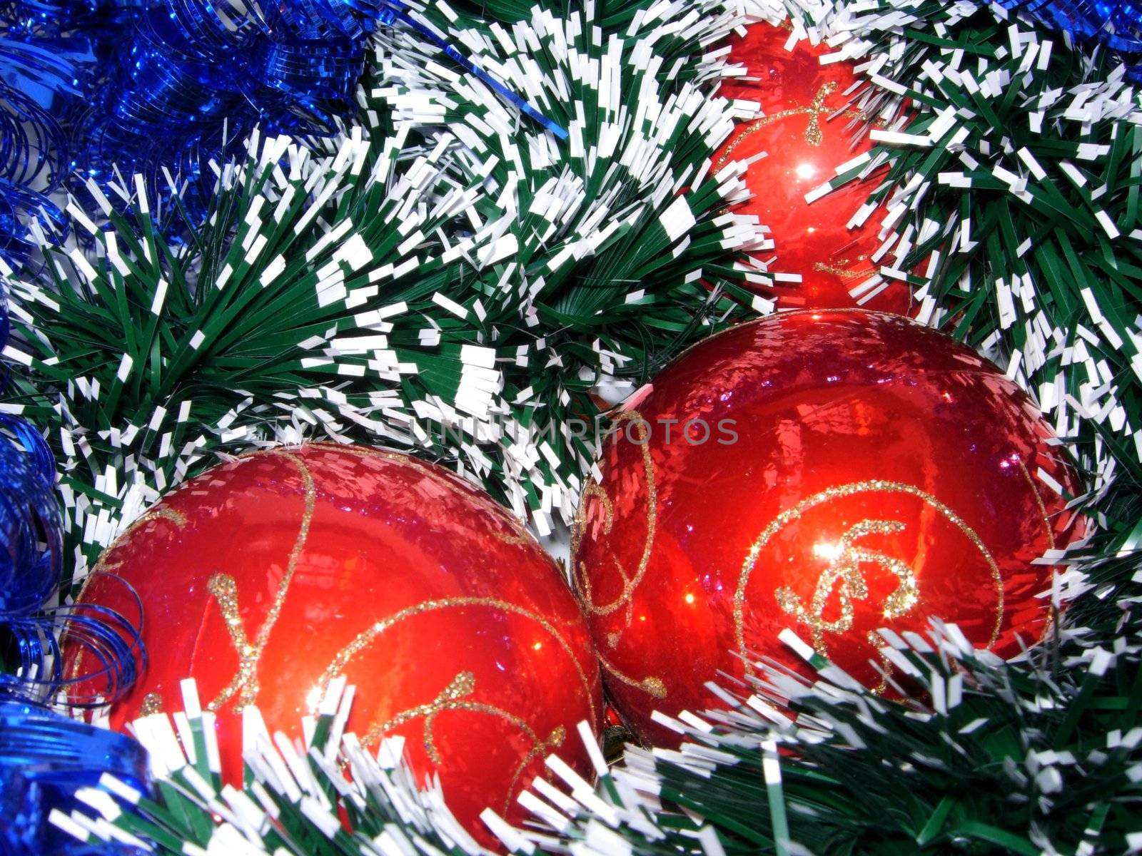 Christmas-tree decorations on a background of garlands