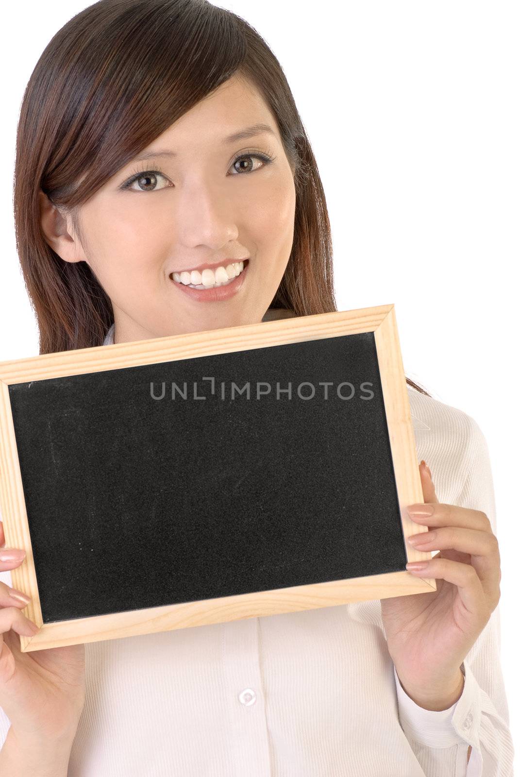 Businesswoman holding blank black board and smile on white background.