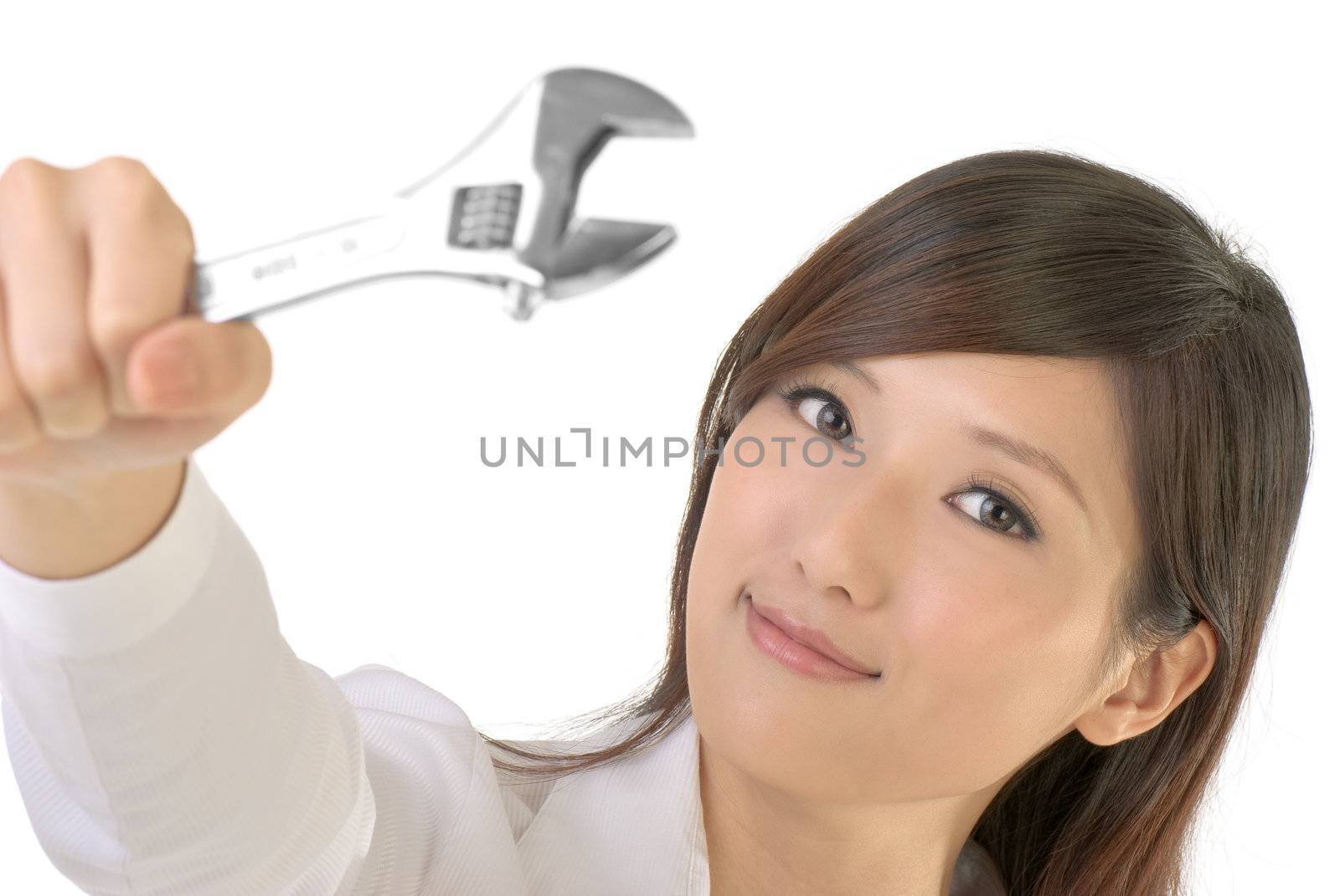 Business woman fix by using wrench with smile on white background.