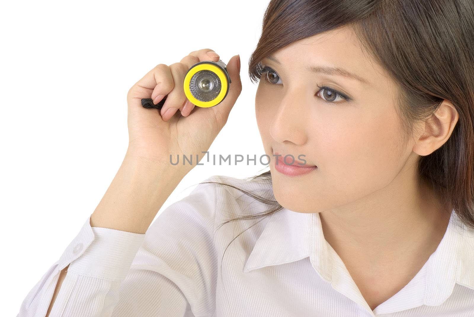 Watching concept of Asian businesswoman holding flashlight on white background.