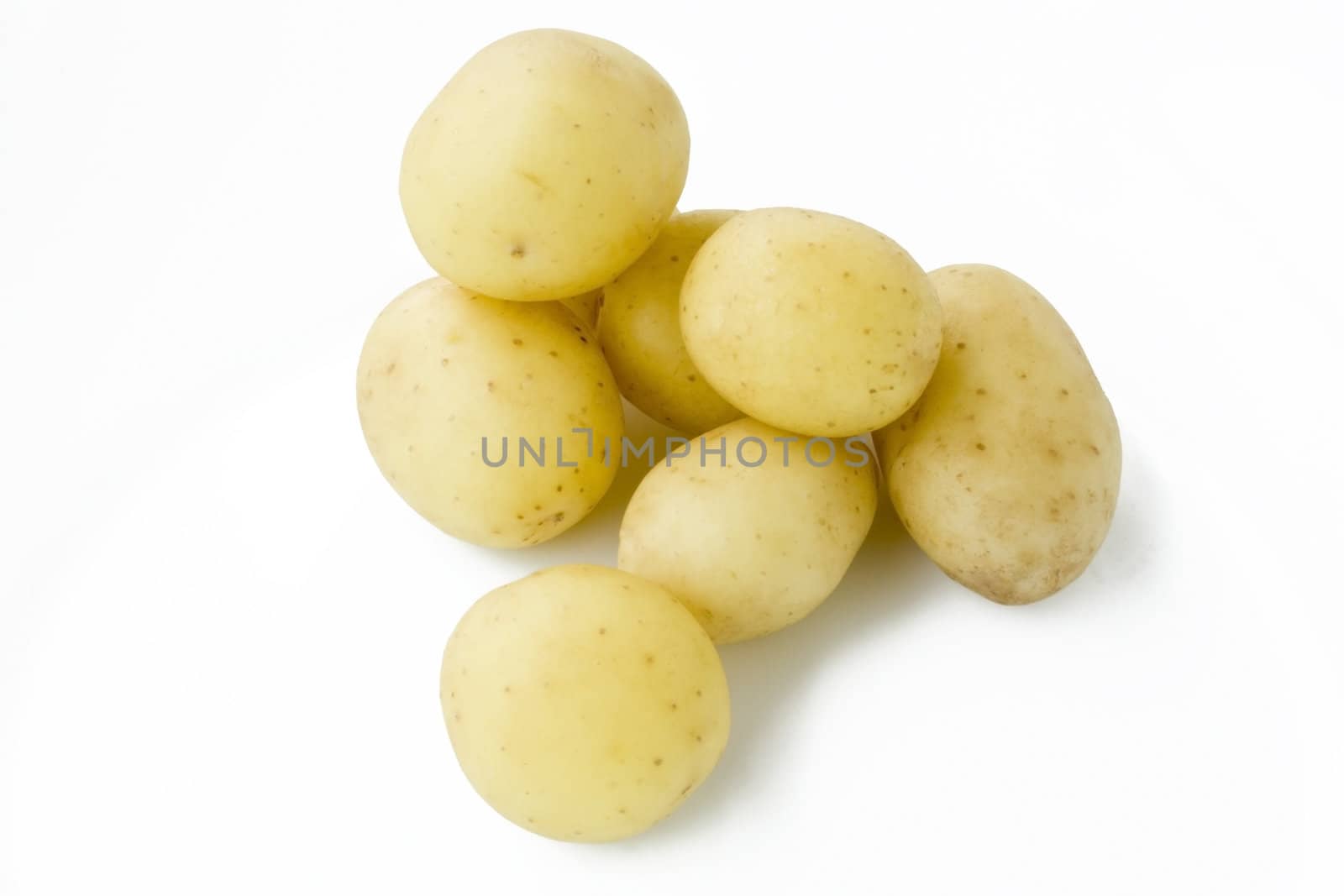 Young potatoes isolated on white background