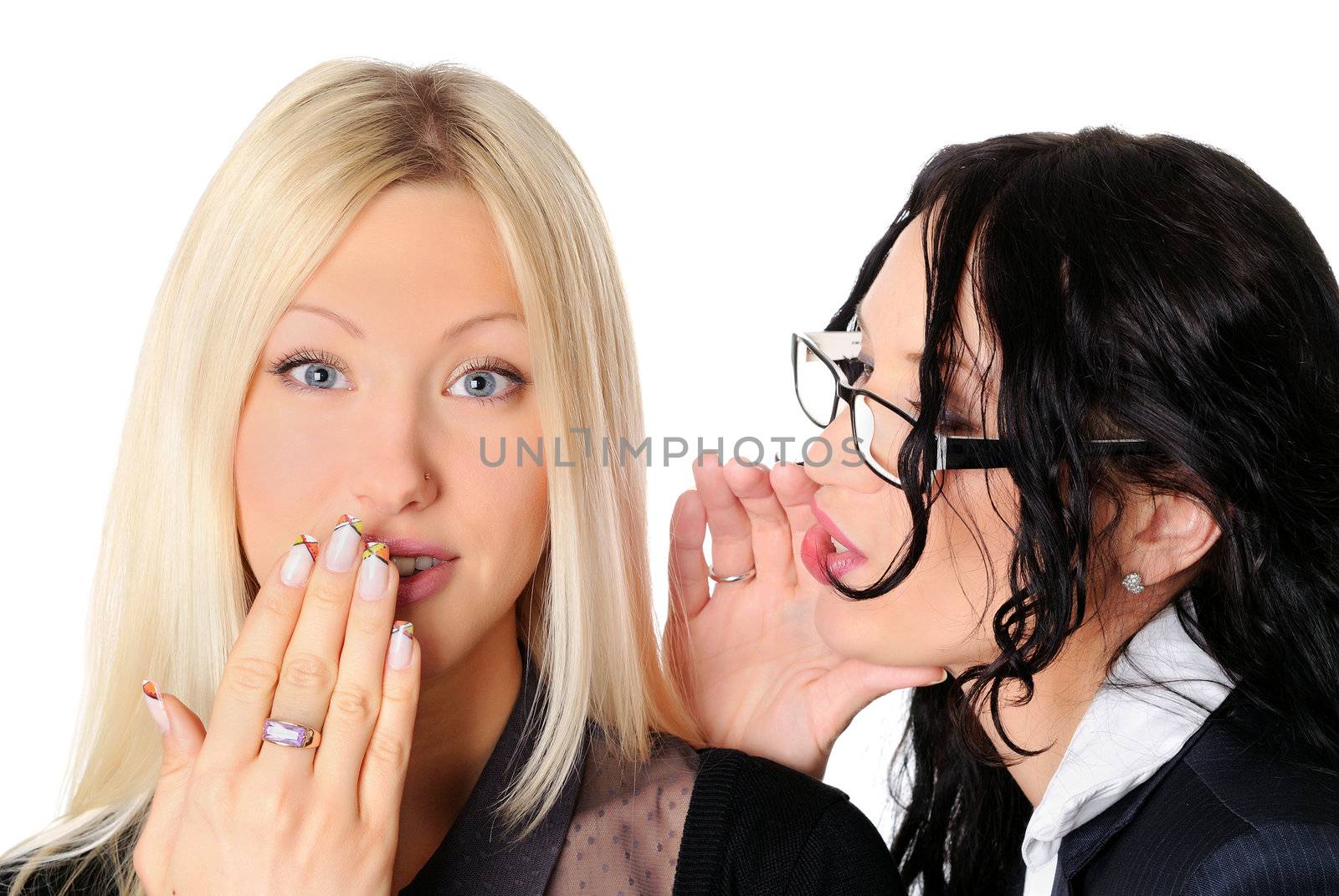 two charming business women whispering to each other 