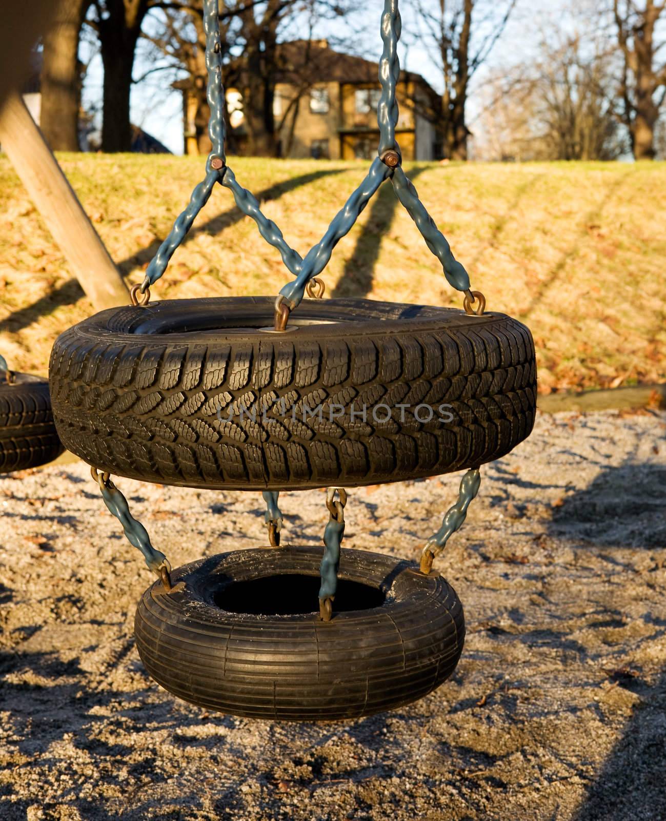 A childs swing on a playground