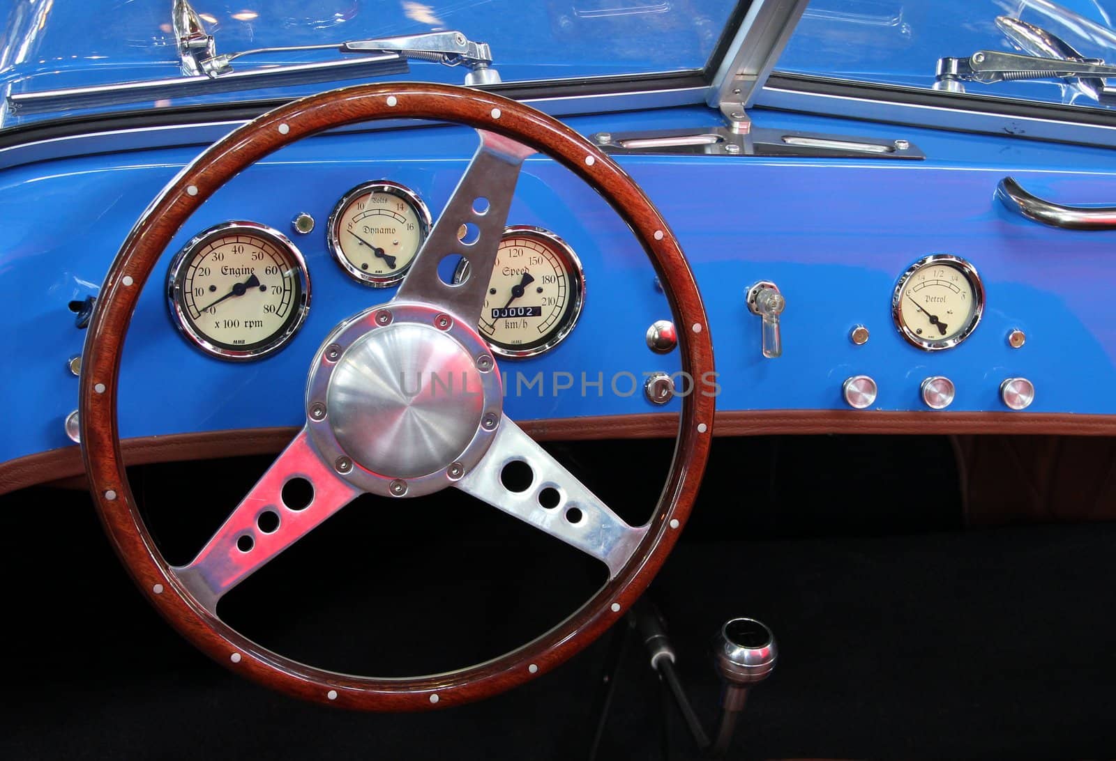 Vintage sports car with blue instrument panel.