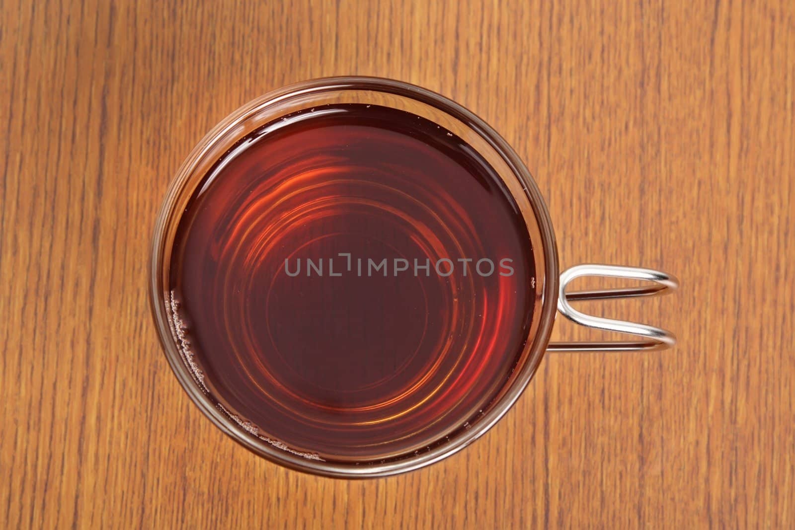 top view of a cup of tea, wood pattern background