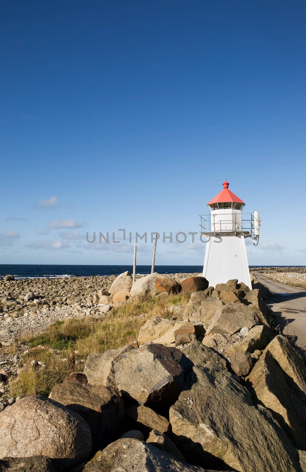 A small lighthouse on a rocky point