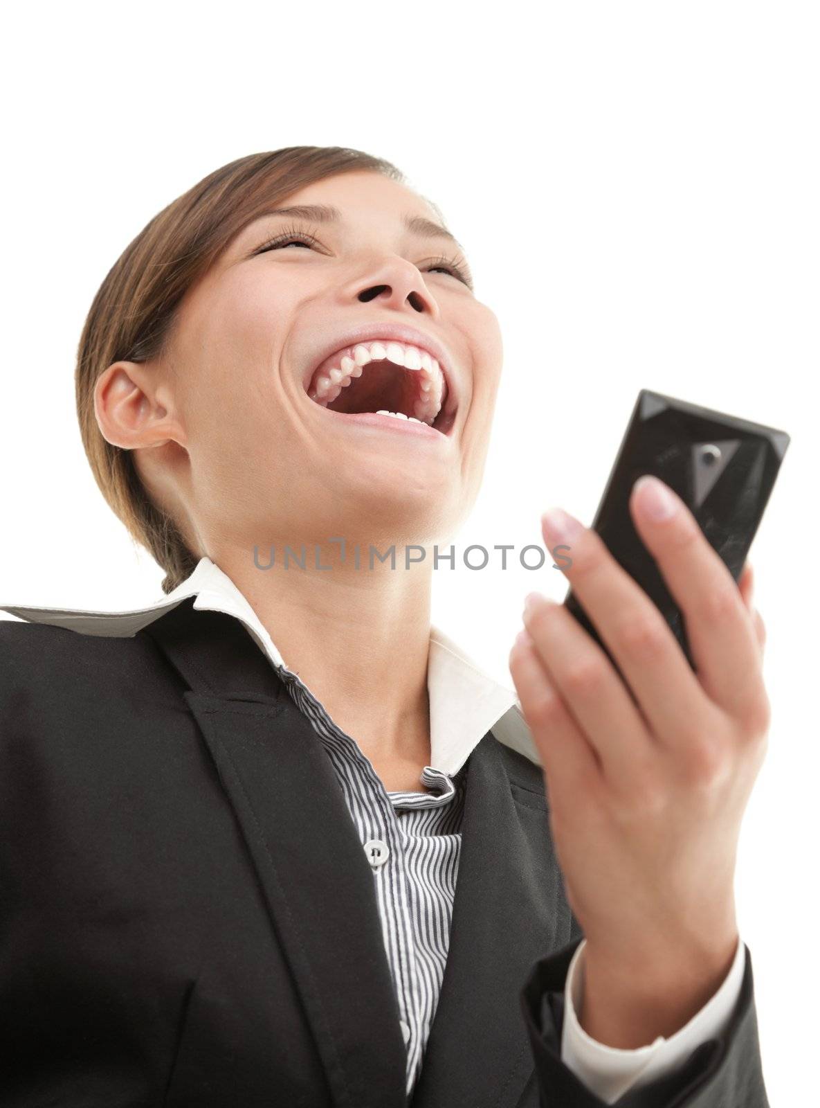 SMS woman getting funny text message on her mobile phone and is laughing. White background.