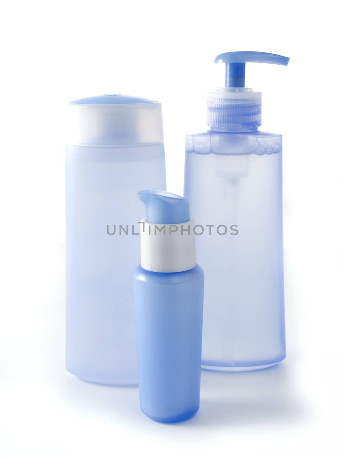 blue cosmetic bottles without labels isolated on white background