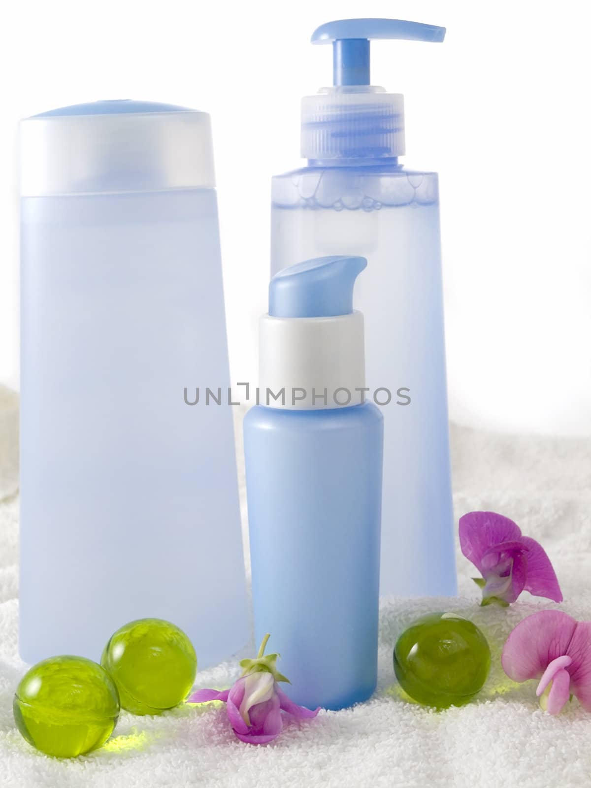 blue cosmetic bottles without labels isolated on white background