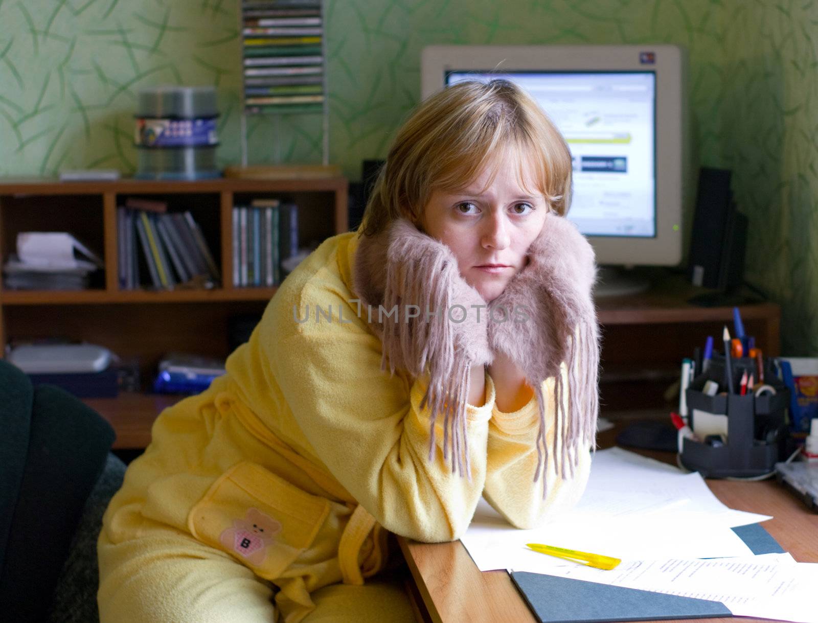 The image of the girl with a scarf on a neck in a house interior