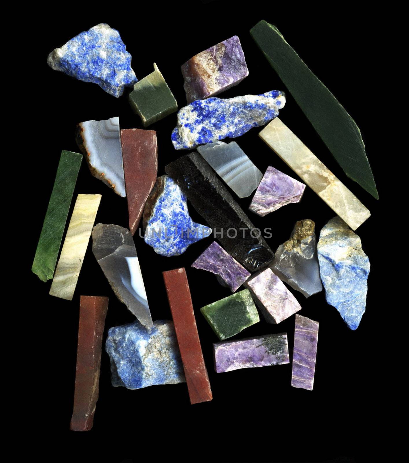 Pieses of semiprecious gems on black background