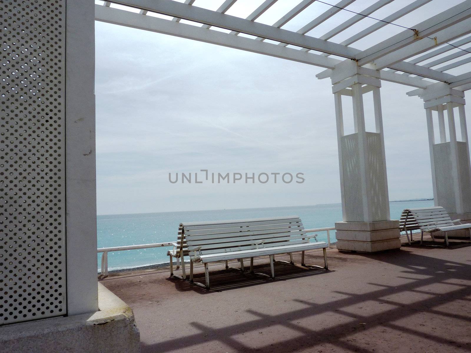 White benches and sea by Elenaphotos21