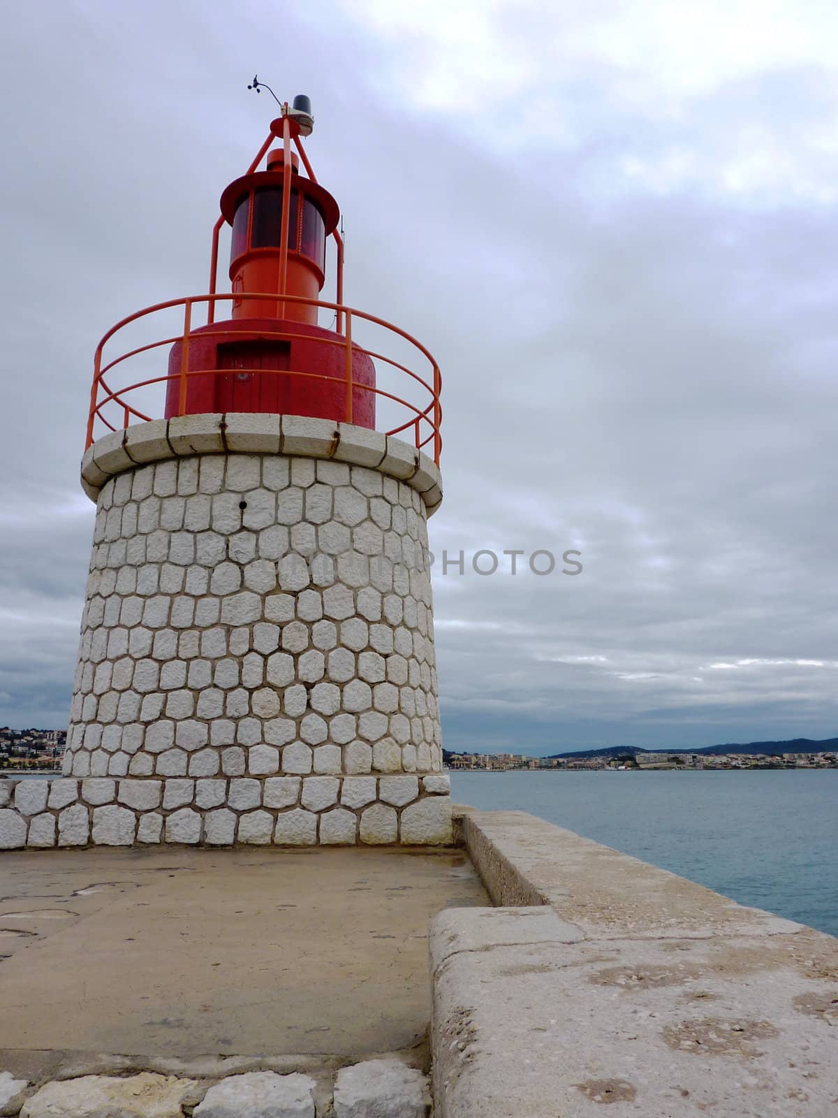 Red lighthouse in Sanary-sur-mer, France by Elenaphotos21