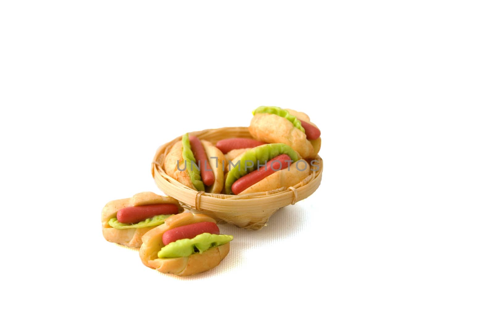 couple of hotdogs in a backet isolated on white