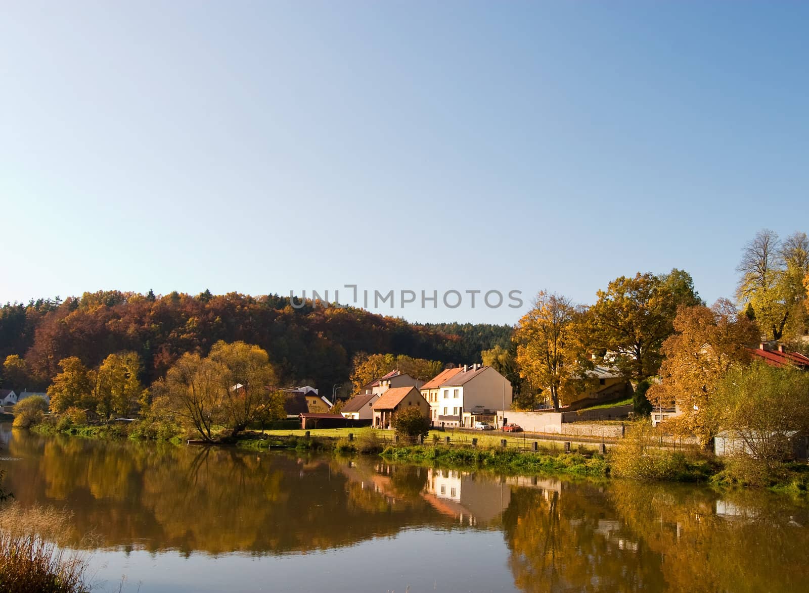 A picturesque fall reflection of a quaint european village in Czech