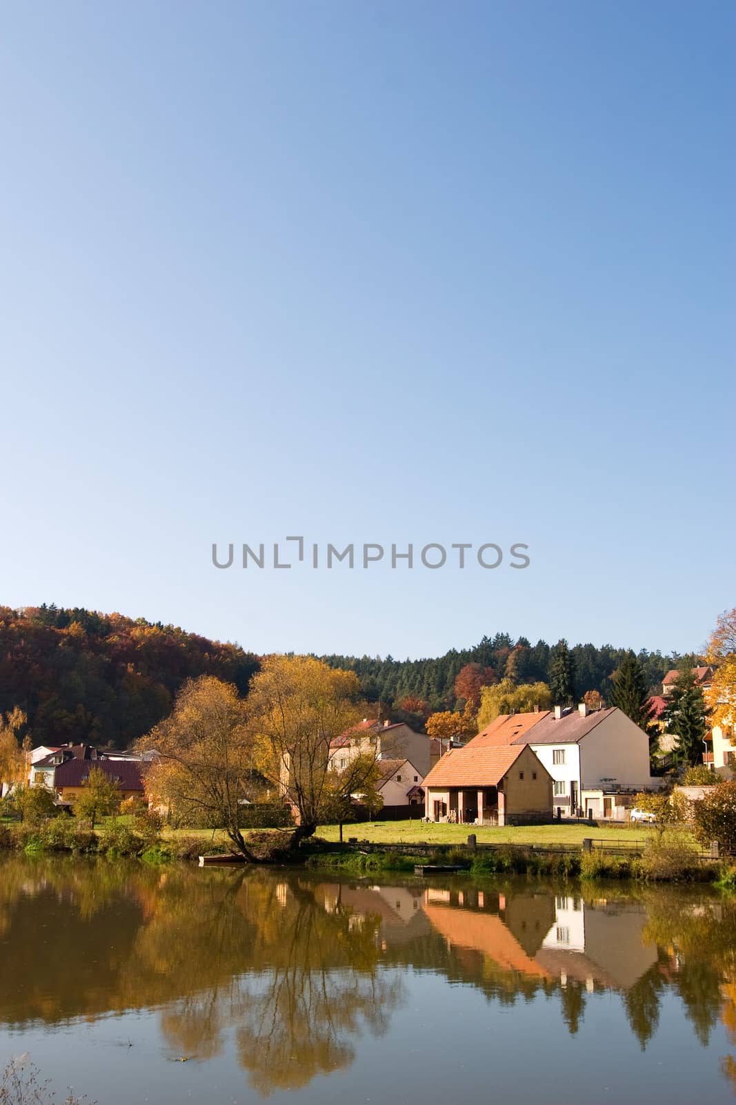 A picturesque fall reflection of a quaint european village