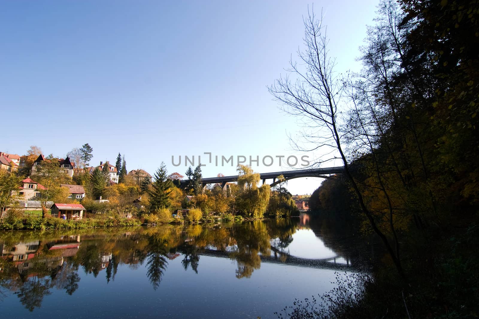 A picturesque fall reflection of a quaint european village in Czech