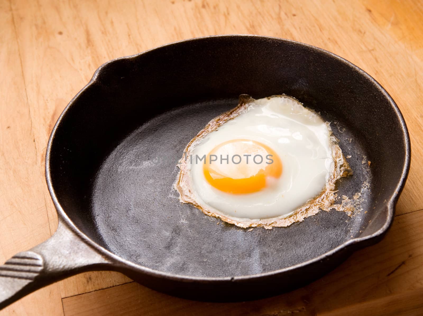 A fried in a cast iron pan.