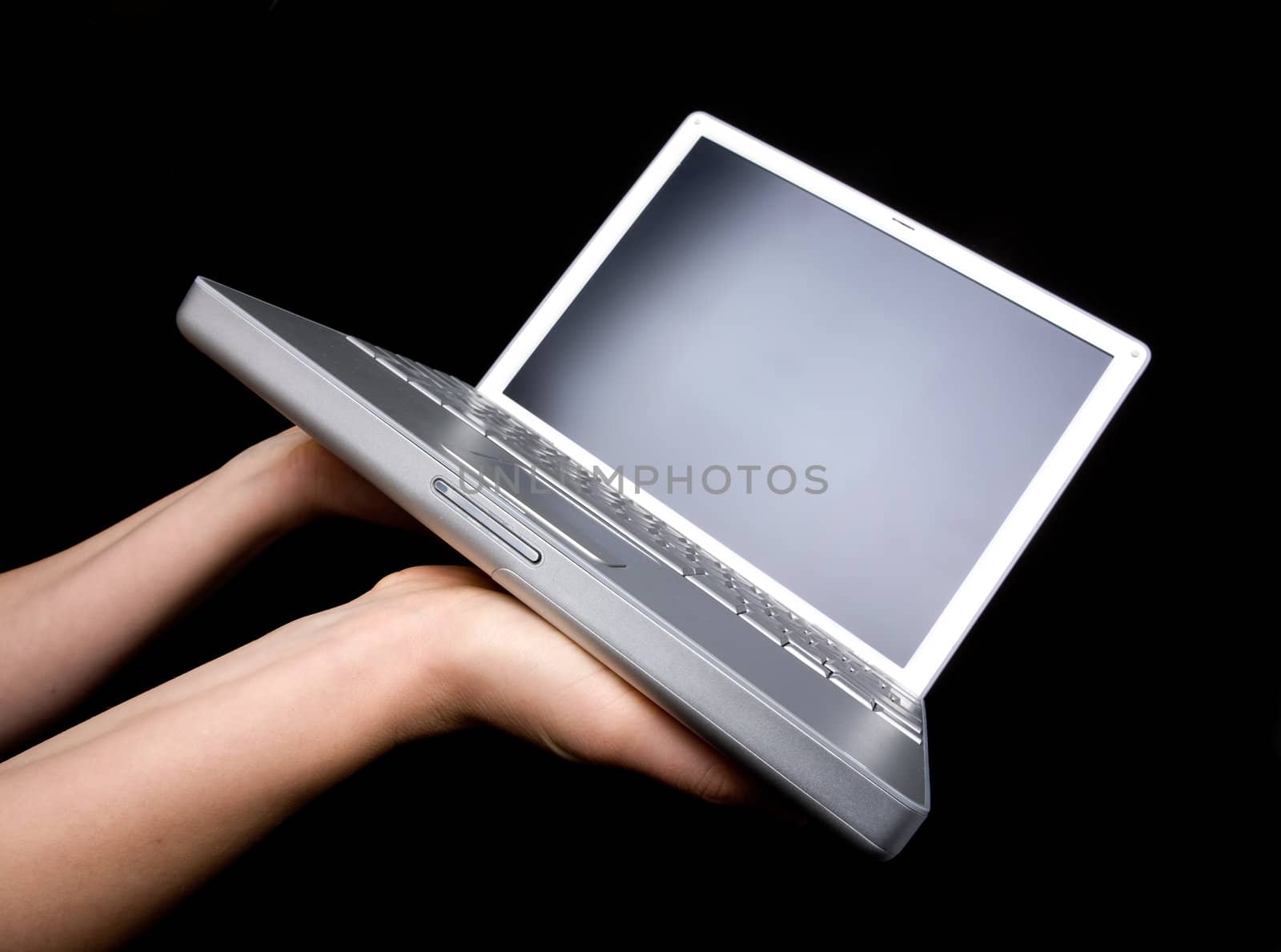 Laptop with blank screen - presented with a pair of hands