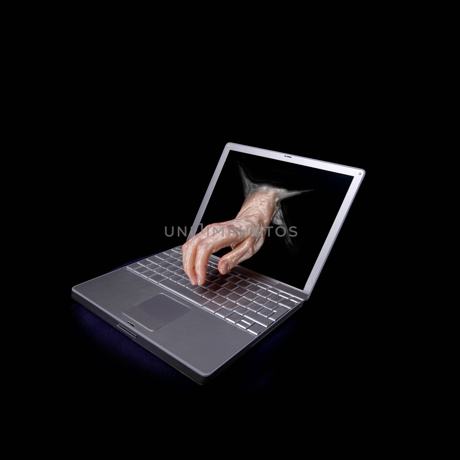 A concept image of a computer hacker attacking a laptop