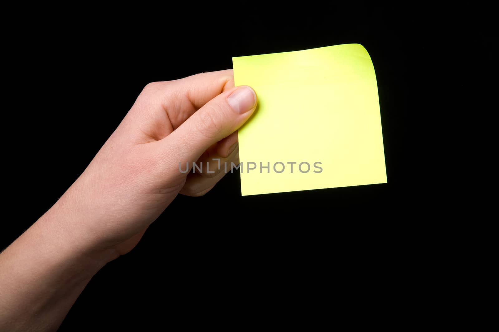 A blank sticky note stuck to a hand - remember this